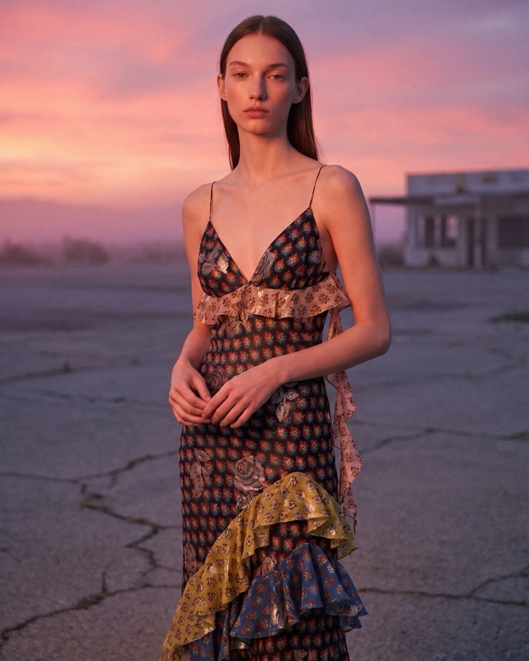 AI fashion campaign, same model in a patterned dress at dusk