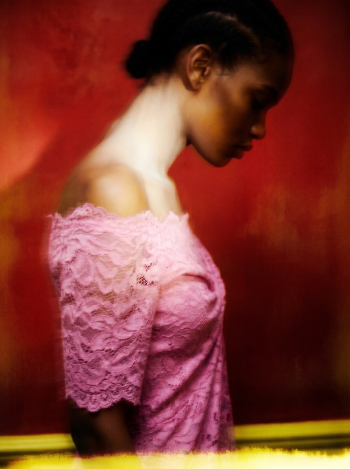 AI fashion model in a pink ruffled dress, editorial portrait